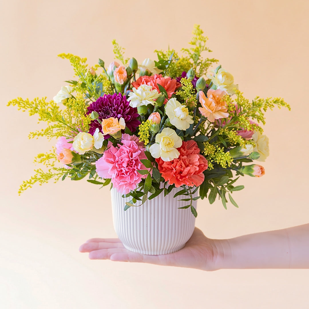 Vibrant yellow and orange birthday flower arrangement